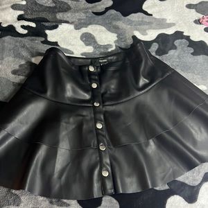 Ruffled black leather skirt